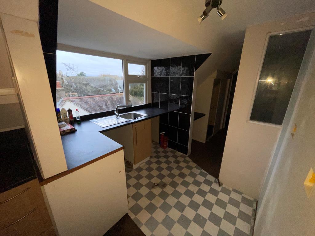 Lot: 57 - FLAT FOR REFURBISHMENT/COMPLETION - Top floor kitchen with window